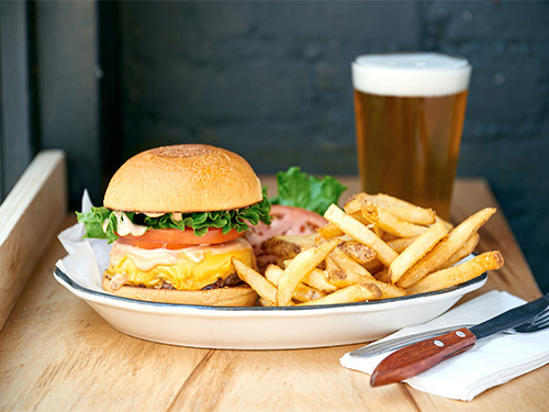 Burger restaurant near Fashion District, New York City serving the best burger with fries and a beer.