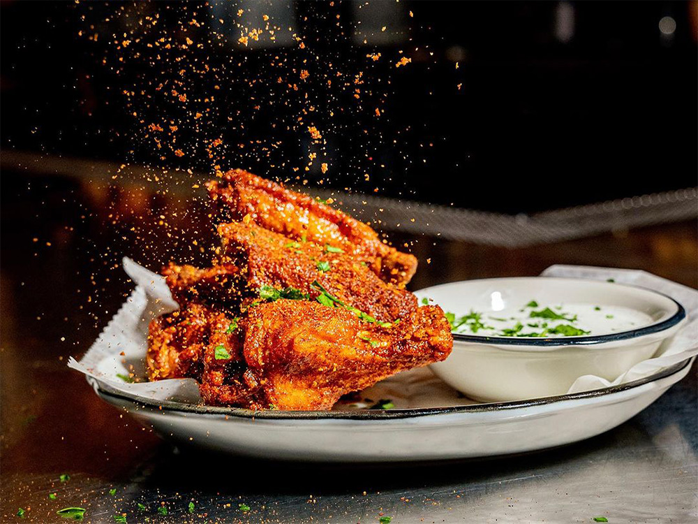 Chili Black Garlic Hot Wings with House Buttermilk-Dill, a top choice for Broadway chicken wing delivery service.