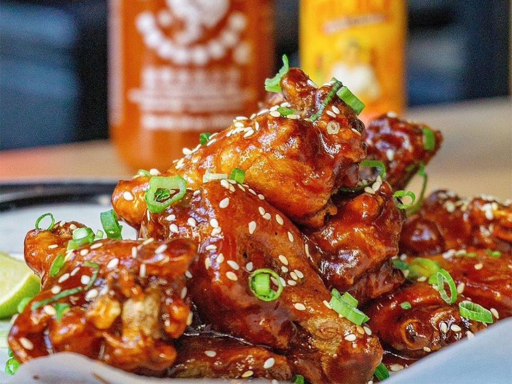 Close up view of our Korean BBQ Wings, a popular option for our wings delivery near Chinatown, New York City.