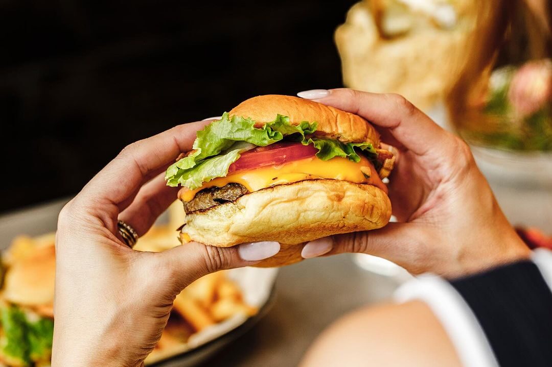 Craft burgers served with crispy sweet potato fries at Black Tap Miami.