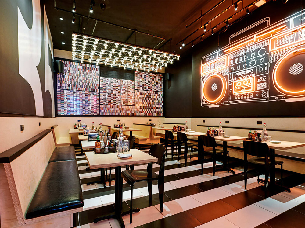 Dining room with tables at one of our Flatiron District holiday party venues.