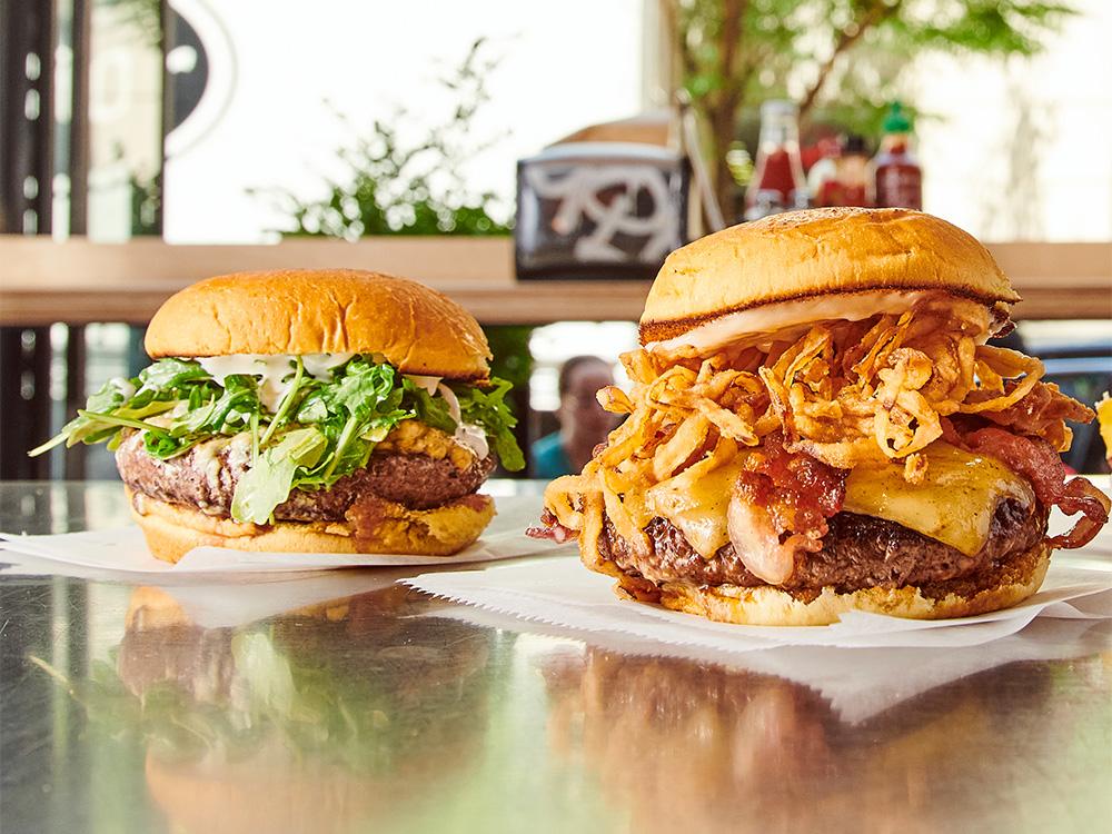 The Champ burger next to the Wagyu Steakhouse Burger, two of our wagyu beef burgers near Belmont, Nashville, Tennessee.