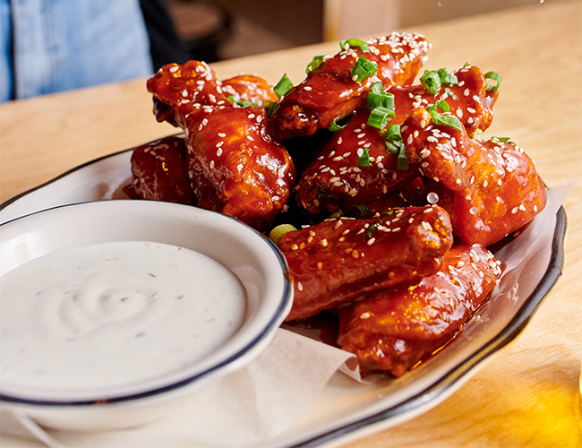 A plate of Korean BBQ wings, some of our best Maryland, London wings.