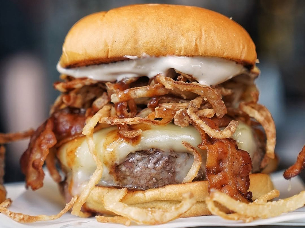 Tasty craft burger prepared for Burgers To Go near Hillsboro Village, Nashville, TN.